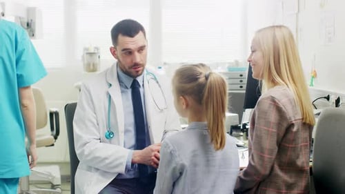 Friendly Doctor Does Routine Examination of a Sweet Little Girl who Came with Her Mother. Pediatric