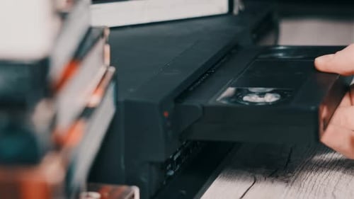 Insert VHS Cassette Into VCR Video Player