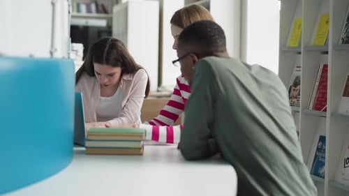 Students Search Online Sources in Library