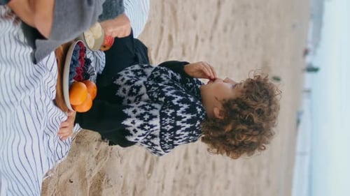 Mom Enjoying Son Picnic on Autumn Ocean Shore Family Spending Time Vertically