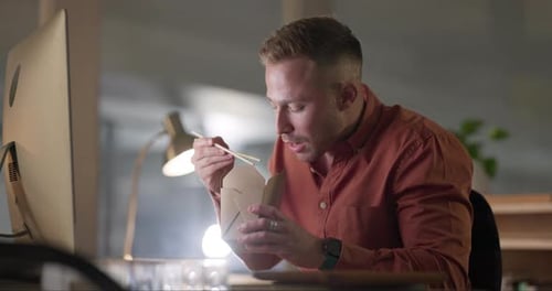 Man, chopsticks and fast food in night, office and eating dinner in box