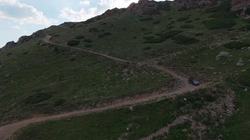 Black Suv Driving on Winding Mountain Road