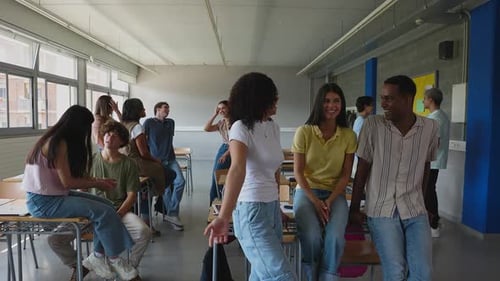 Diverse Young High School Students Hanging Out in Classroom During Break