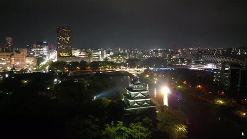 Aerial video of the Hiroshima skyline with Hiroshima Castle in Japan