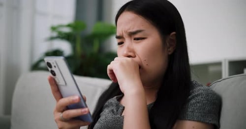 Woman Reacting to Bad News on Phone