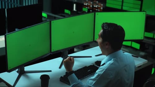 Happy Asian Man Celebrating While Working With Mock Up Multiple Computer Monitor In office
