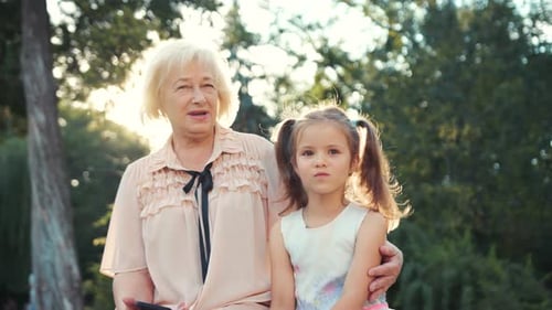 Grandmother and Granddaughter Enjoying Time in Park Together