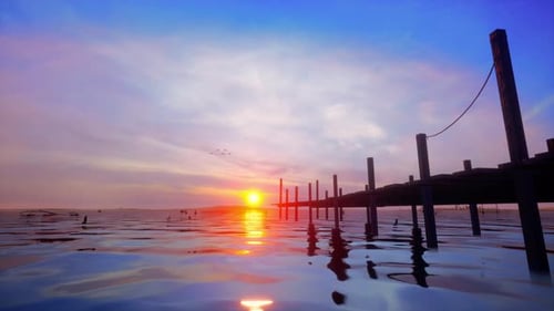 Tranquil Sunset Over Water with Pier Reflection