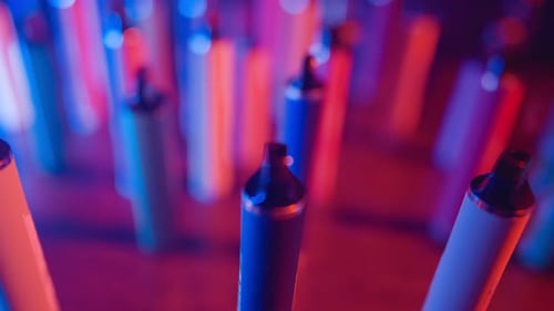 Close Up of Colorful Vape Pens with Neon Lights