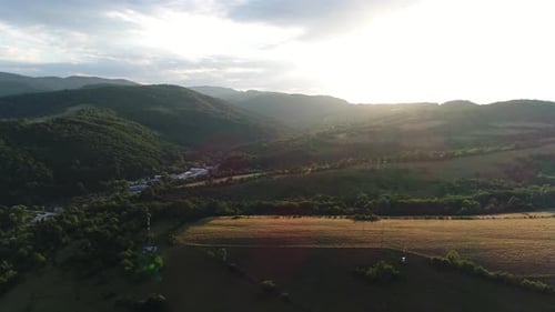 Scenic Aerial View of Rural Mountains at Sunset
