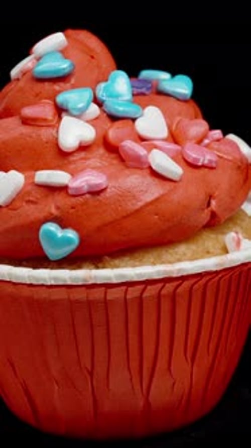Festive Cupcake Rotating on Black Background