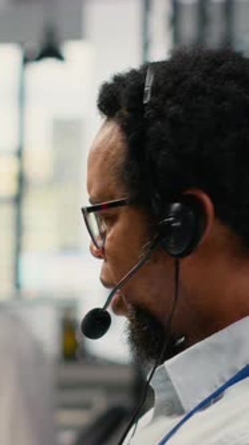 Vertical Video Close Up of Startup Software Developer Doing Tech Support Helping Users