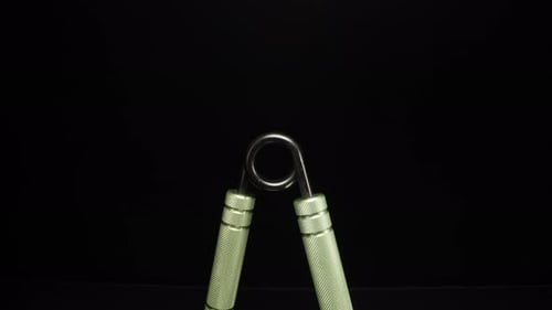 hand trainer, metal expander. Dolly slider extreme close-up. Laowa Probe