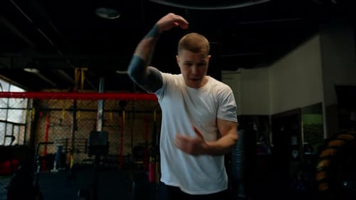 Male boxer training fit man doing boxing in gym young man doing warm up stretching muscles