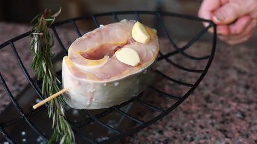 chef prepares a salmon dish in the kitchen. Close-up shots