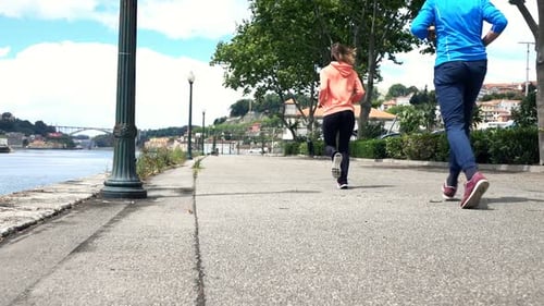 Young Couple Jogging in City Near River, Super 120