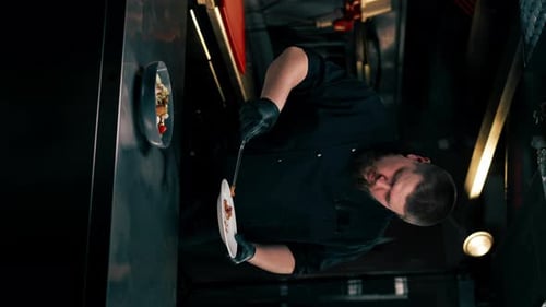 Chef Plates Gourmet Salad in Restaurant Kitchen