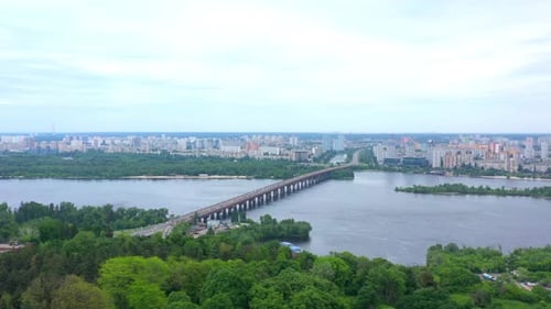 Aerial drone footage. Big bridge with road for cars under the river.