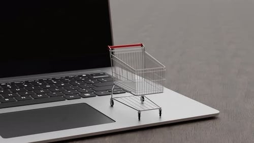 Shopping Cart on Laptop Keyboard for Online Retail