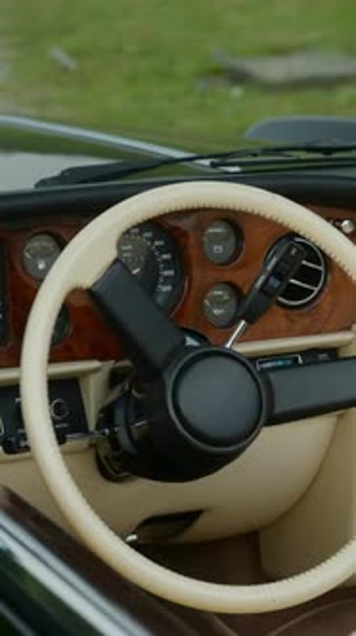 Vintage Car Dashboard and Steering Wheel Close Up