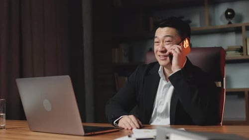 Real Estate Agent Making Offers to Client on Cellphone