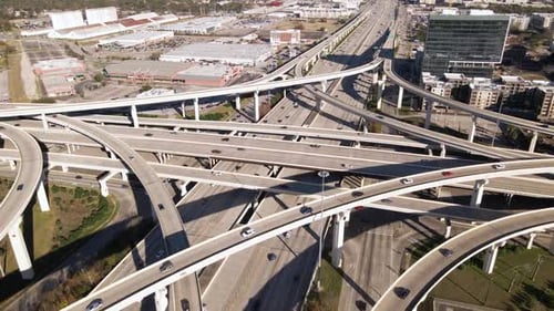 A High Aerial Overlook of Intricate City Highway Interchange Systems