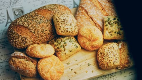 Variety of Fresh Baked Bread on Cutting Board