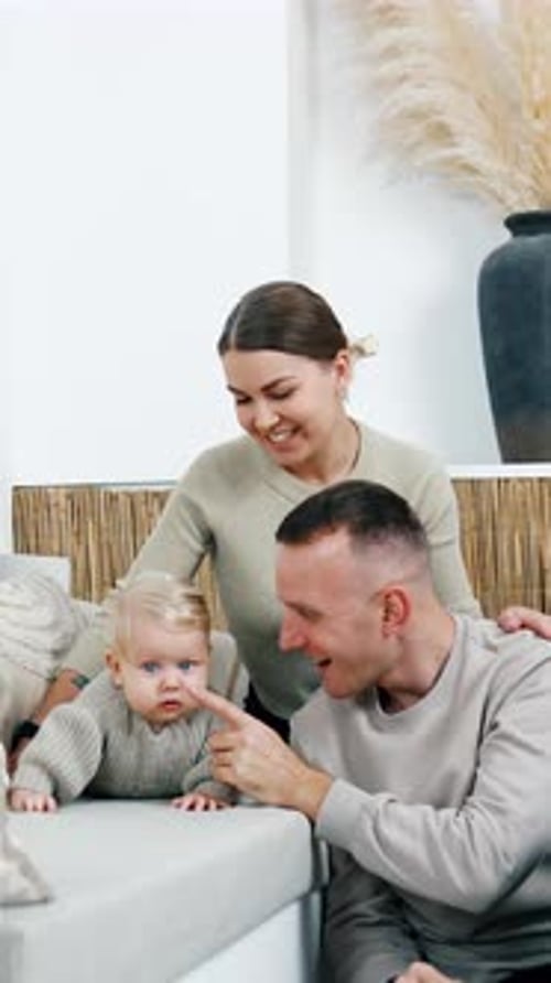 Loving Parents Playing with Baby at Home