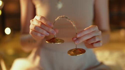 Woman Holds Meditation Cymbals