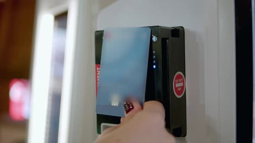 Hand Using Debit Card on Card Reader