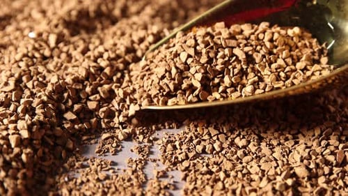 Gold Spoon Pouring Pile of Instant Coffee Granules