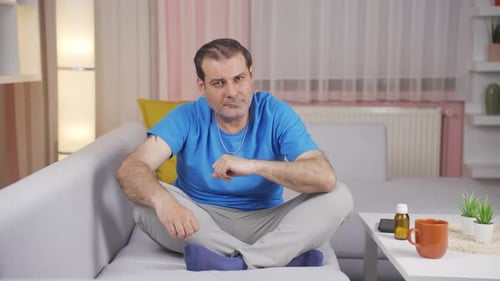 Man looking negative at camera.