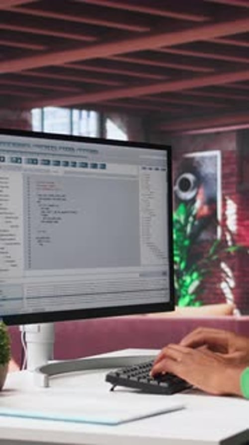 Adult Typing on Keyboard in Home Office