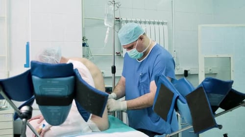 Surgeon Prepares Patient in Hospital Operating Room