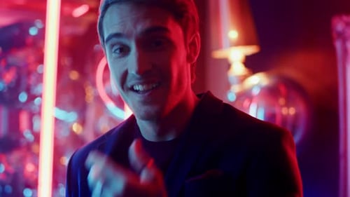 Closeup Happy Man Laughing at Club Party. Portrait of Smiling Male Person