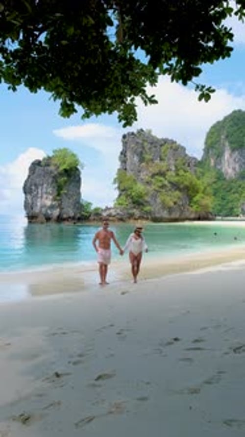 Couple Men and Women on a Tropical White Beach in Thailand Koh Hong Island Krabi