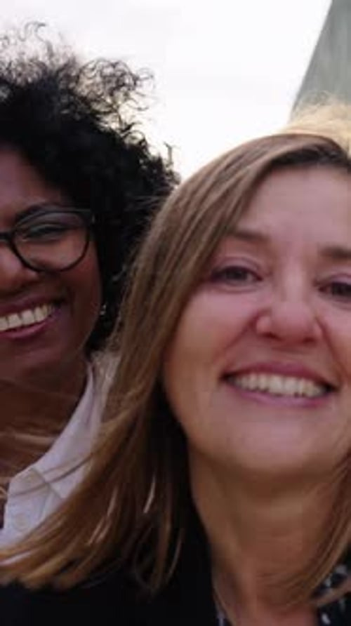 Smiling Women Posing for Selfie in City