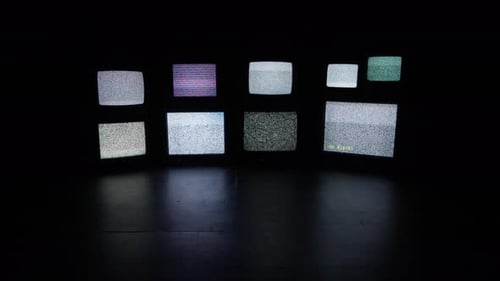 Multiple Old Televisions Displaying Static
