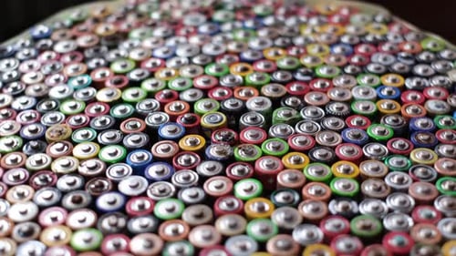 Pile of Used Batteries for Recycling and Disposal