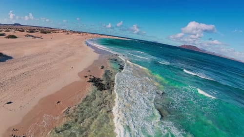 Aerial view of tropical beach with clear ocean water