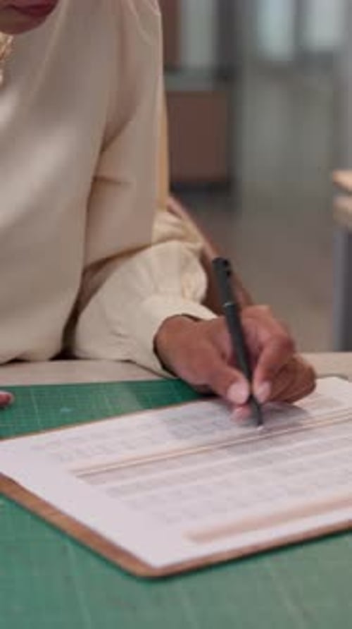 Hands, clipboard and writing for logistics at warehouse with sales report