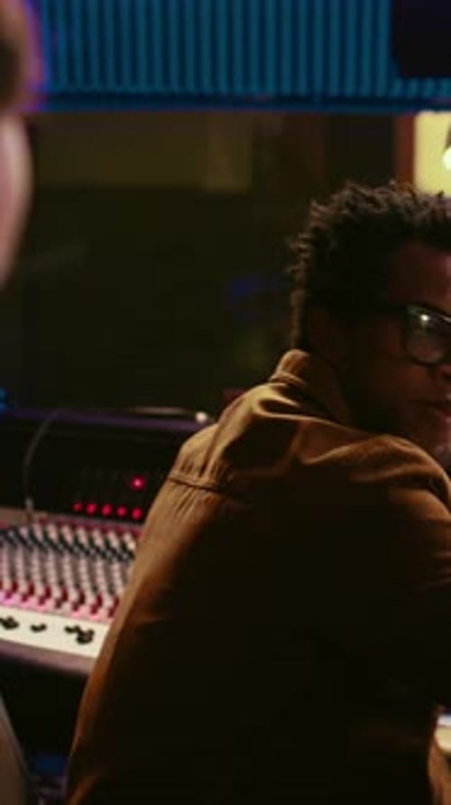 Musicians Work in Recording Studio on Song