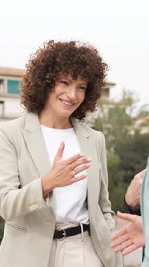 Business Woman Shakes Hands After an Agreement