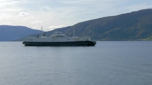 A Ferry Travels through a Fjord on a Sunny Summer Day in Norway, Slow Motion