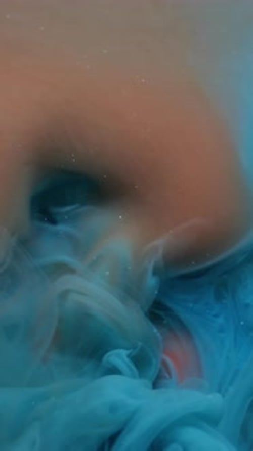 Swirling Blue Dye in Water Abstract