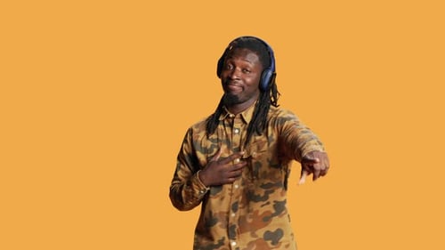 Young Man Listening to Music and Dancing