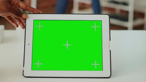 Young Woman Holding Device with Horizontal Green Screen
