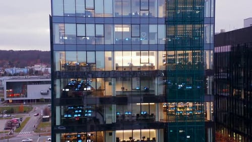 Aerial View of Skyscraper Facade and Corporate Offices at Night