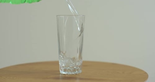 Sparkling Water Poured Into Glass Indoors