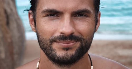 Attractive Man Poses on Tropical Beach